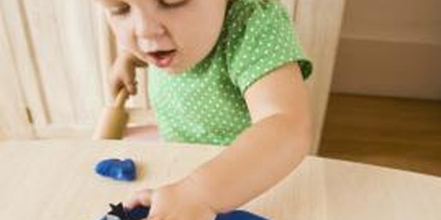 Jupiterimages/Polka Dot/Getty Images Modeling clay can open up a world of sensory exploration for your child.