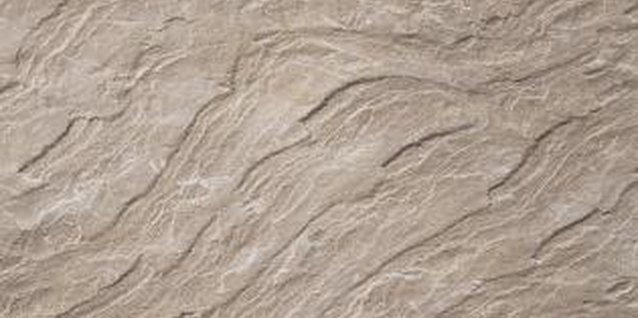 Brand X Pictures/Brand X Pictures/Getty Images With its soft color and rough texture, limestone makes an understated and elegant edging option.