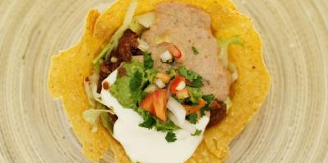 Stockbyte/Stockbyte/Getty Images Adding lime to sour cream complements its flavor, and won't make it curdle.