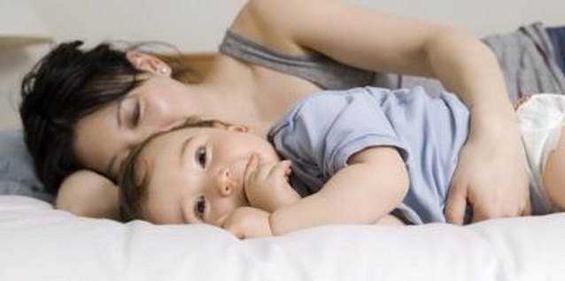 Jupiterimages/Creatas/Getty Images Having a toddler in bed with you might disrupt your sleep.
