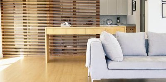 Goodshoot/Goodshoot/Getty Images A retractable bamboo screen divides the two rooms without blocking the view.