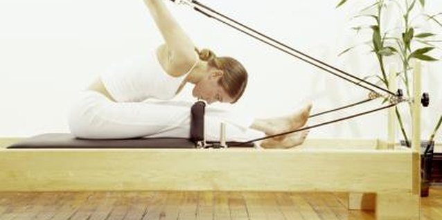 Brand X Pictures/Brand X Pictures/Getty Images Pilates can be done on a mat or machine.