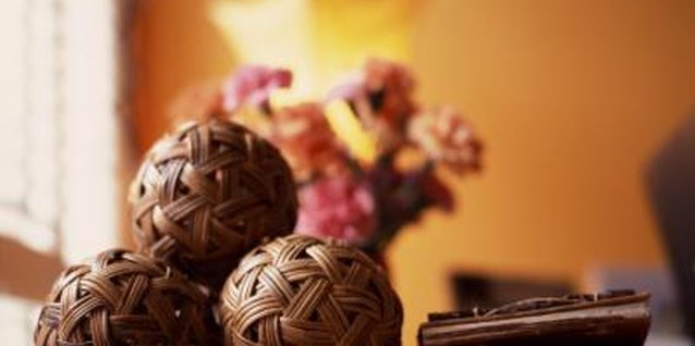 Creatas Images/Creatas/Getty Images Look for durable earthy accents, such as wicker balls grouped on a coffee table.