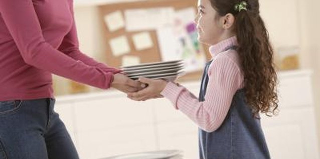 Comstock Images/Comstock/Getty Images Giving your preschooler chores helps build her skills and confidence.