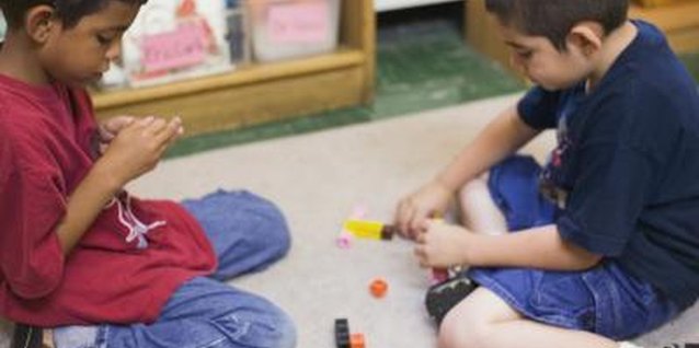 Creatas/Creatas/Getty Images Teach children how to help each other to make activity transitions smoother.