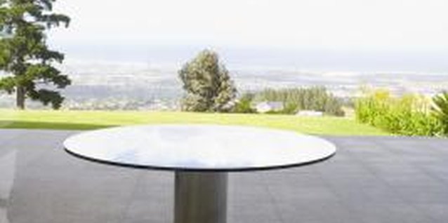 Goodshoot/Goodshoot/Getty Images Use a few ordinary items to create a base for any table.