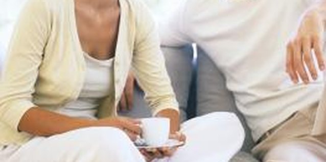 Goodshoot/Goodshoot/Getty Images Positive body language and active listening can help couples to communicate more effectively.