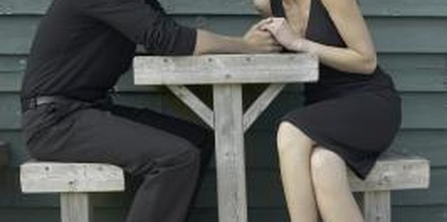 Hemera Technologies/AbleStock.com/Getty Images Partners should discuss ending the marriage in person.