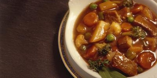 Jupiterimages/Comstock/Getty Images Beef stew can simmer all day in your slow cooker.
