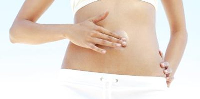 Goodshoot/Goodshoot/Getty Images Dry skin breakouts can occur anywhere, even on your abdomen.