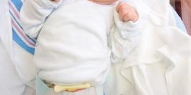 Jupiterimages/Comstock/Getty Images Newborns typically don't have a set sleeping schedule.