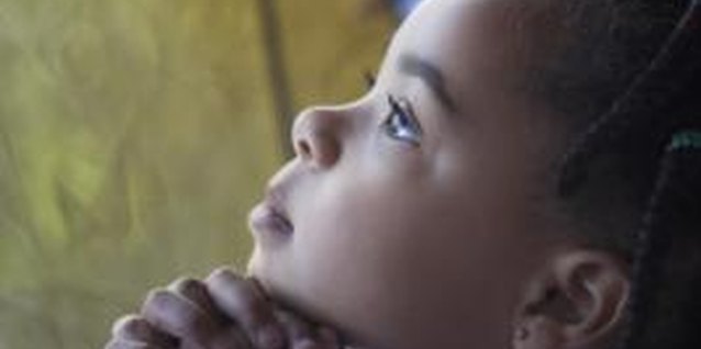 Brand X Pictures/Brand X Pictures/Getty Images Catechesis helps children explore their spiritual nature.