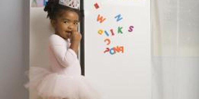 Jupiterimages/Creatas/Getty Images Keep your curious child out of the fridge.