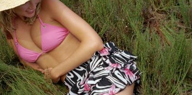 Polka Dot Images/Polka Dot/Getty Images Shortening a swimsuit skirt isn't as hard as you might think.