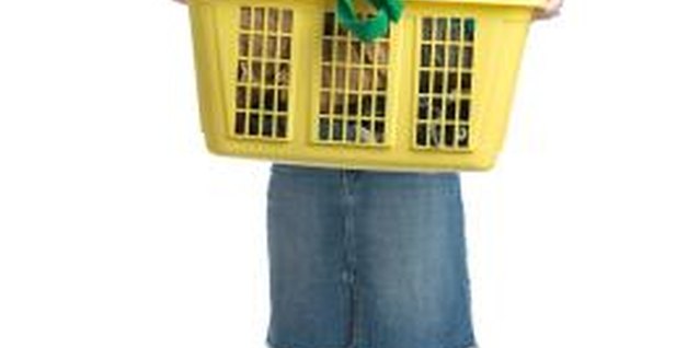 Photos.com/PhotoObjects.net/Getty Images Helping with family laundry is one possible chore to earn allowance.