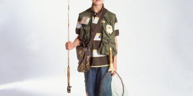 Creatas/Creatas/Getty Images Replicate a kid's fishing hat with craft items you have around the house.