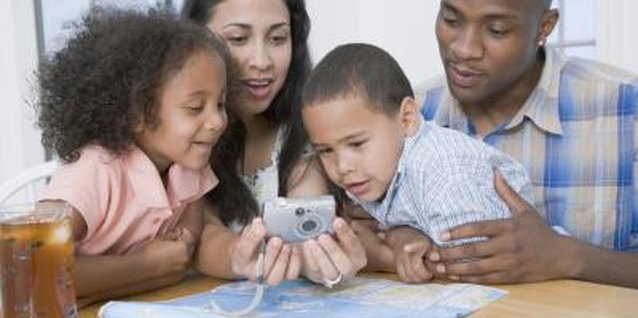 Jack Hollingsworth/Photodisc/Getty Images Increase your child's map awareness by trying to find locations you've visited on the map.