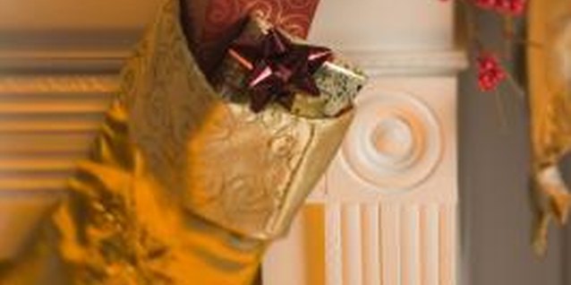Comstock Images/Comstock/Getty Images Skip the hefty and expensive stocking hangers this Christmas and opt for temporary adhesive hooks.