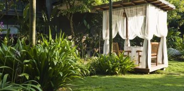 Jupiterimages/Goodshoot/Getty Images A pergola models the basic idea of a more rustic, less costly shade house.