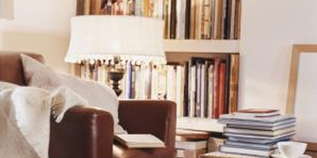 Digital Vision./Digital Vision/Getty Images Painting built-in shelves to match the surrounding walls can help make a room appear larger.