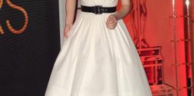 Kevin Winter/Getty Images Entertainment/Getty Images Actress Emma Stone wears a belted dress to the 85th Annual Academy Awards nomination announcements in January 2013.