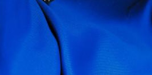 Jupiterimages/Photos.com/Getty Images Inexpensive costume jewelry can add style and secure a new hemline.