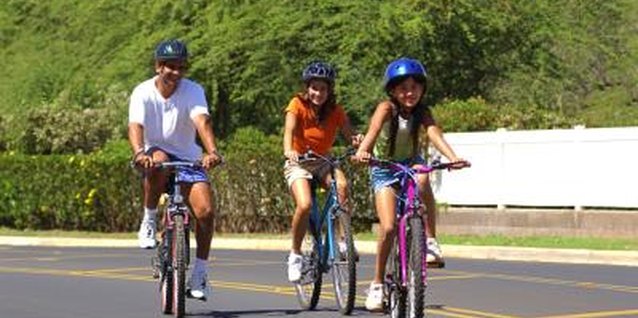 Liquidlibrary/liquidlibrary/Getty Images Bike rides are an enjoyable way to promote fitness among all family members.