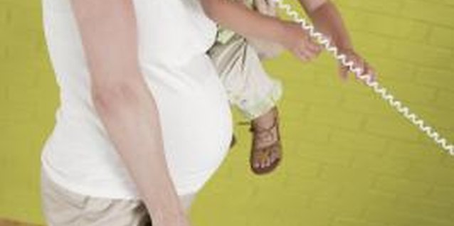Comstock/Comstock/Getty Images Taking care of a toddler while trying to squeeze in housework can be a major source of stress.