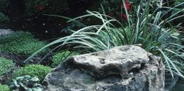 Hemera Technologies/Photos.com/Getty Images Boulders help make water features look more natural.
