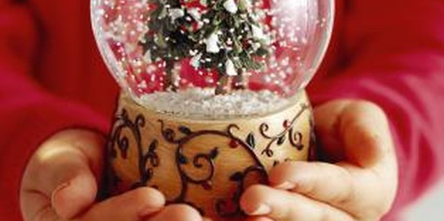 Brand X Pictures/Brand X Pictures/Getty Images Watching a snow globe can be a calming activity for a spirited toddler.