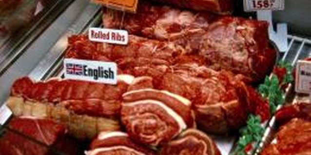Jupiterimages/Comstock/Getty Images Excess protein intake may increase your cholesterol.