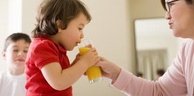 Thinkstock Images/Comstock/Getty Images Help your toddler drink 100 percent juice from a glass or cup.