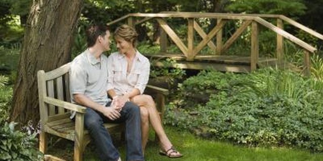 Jupiterimages/Comstock/Getty Images Hide an ugly pipe with a garden bench.