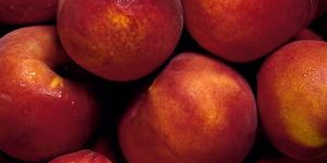 Brand X Pictures/Brand X Pictures/Getty Images Some prefer the fuzz-less flesh of nectarines over peaches.