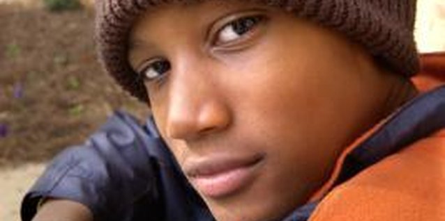 Thinkstock Images/Comstock/Getty Images Shyness can prevent teen boys from interacting socially.