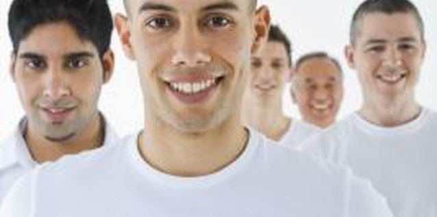 Jupiterimages/Polka Dot/Getty Images Whiten cotton T-shirts with a vinegar soak.