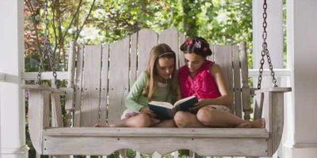Jupiterimages/Comstock/Getty Images A porch swing is a terrific spot to read with a friend.