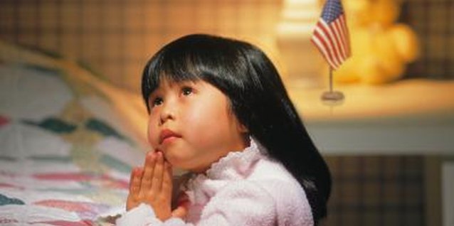 Comstock/Comstock/Getty Images Prayer cards can help your child make prayer and every day occurrence.