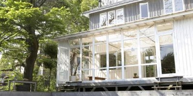 ULTRA F/Photodisc/Getty Images Although a sunroom is protected from wind and snow, temperatures can plummet.