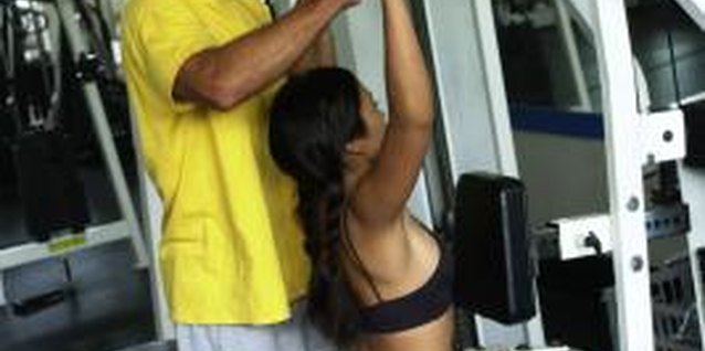 Thinkstock/Comstock/Getty Images Select the right grip on lat pulldowns to effectively work your upper back.
