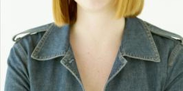 Jupiterimages/Photos.com/Getty Images Instead of a blazer, try a denim shirt as a jacket over your favorite work dress.