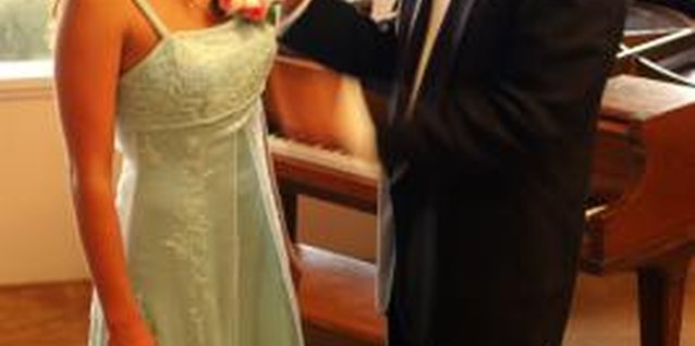 Jupiterimages/Comstock/Getty Images Deodorize your prom dress after wearing to keep it smelling fresh.