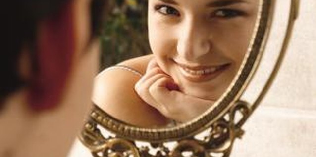 Photodisc/Photodisc/Getty Images A round mirror frames the face and is perfect for a vanity or dresser.