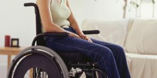 Ryan McVay/Photodisc/Getty Images Wheelchair resistance band exercises will improve strength to make everyday activities easier to do.
