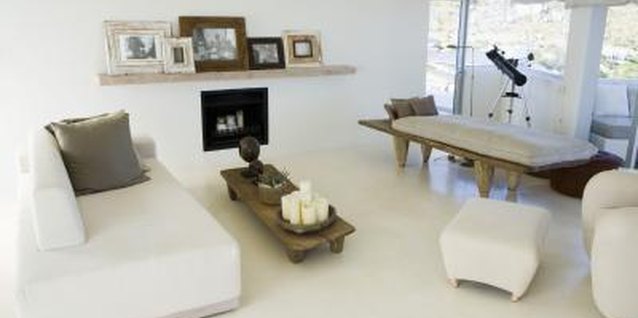 Goodshoot/Goodshoot/Getty Images Photos clustered on a mantle make for a clean, modern look.