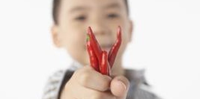 Sean Justice/Stockbyte/Getty Images Kids can enjoy Goat's Weed peppers if they have supervision.