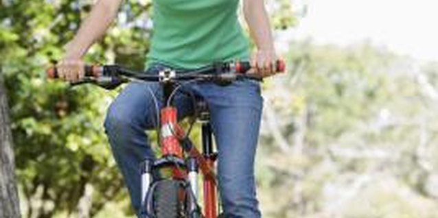 BananaStock/BananaStock/Getty Images Choose the right bicycle size for optimal comfort and safety.