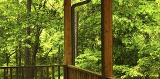 Thinkstock/Comstock/Getty Images Place deck boards perpendicular to the length of the deck.