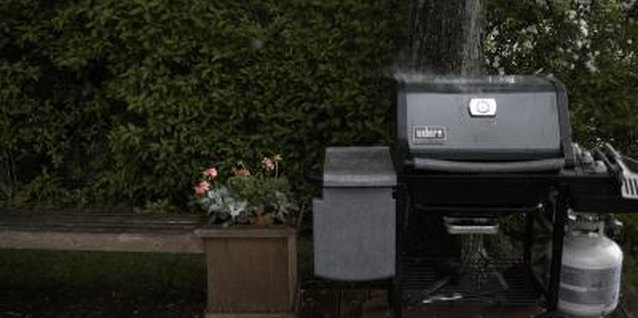 Bob Scott/Photodisc/Getty Images For best results, use a two-zone fire to cook thick pork chops.