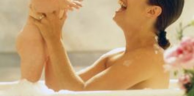 Jupiterimages/liquidlibrary/Getty Images Bathing with your child can be a time to bond and have fun.